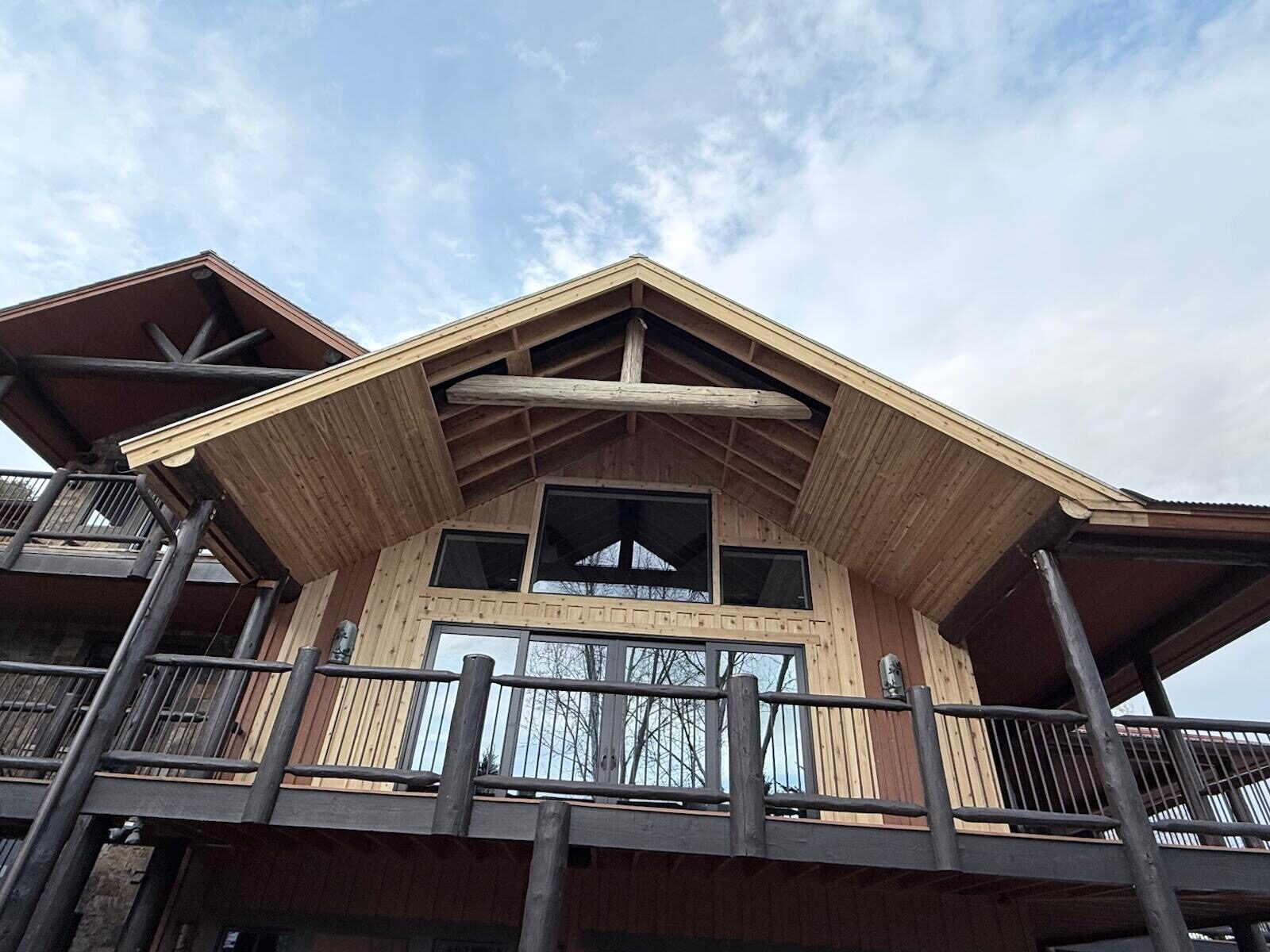 Timber gables and warm wood details on a Colorado mountain home